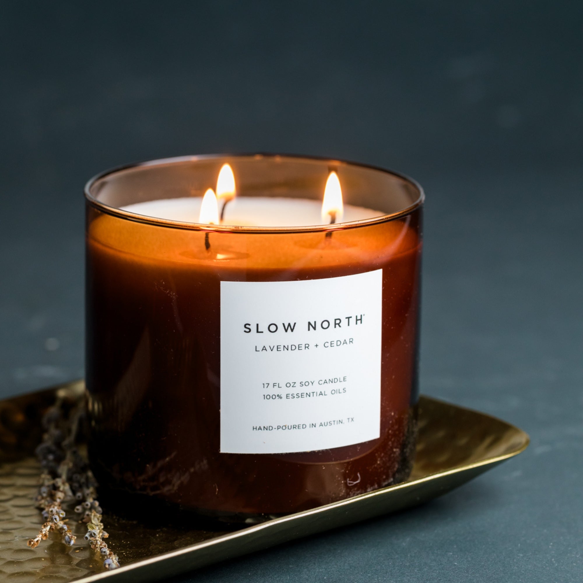 large amber candle with 3 wicks by Slow North