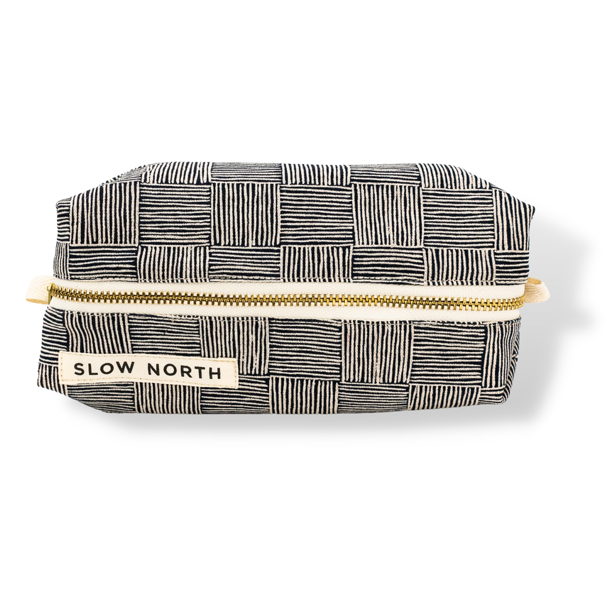 Patterned pouch with gold zipper and 'Slow North' label on a white background