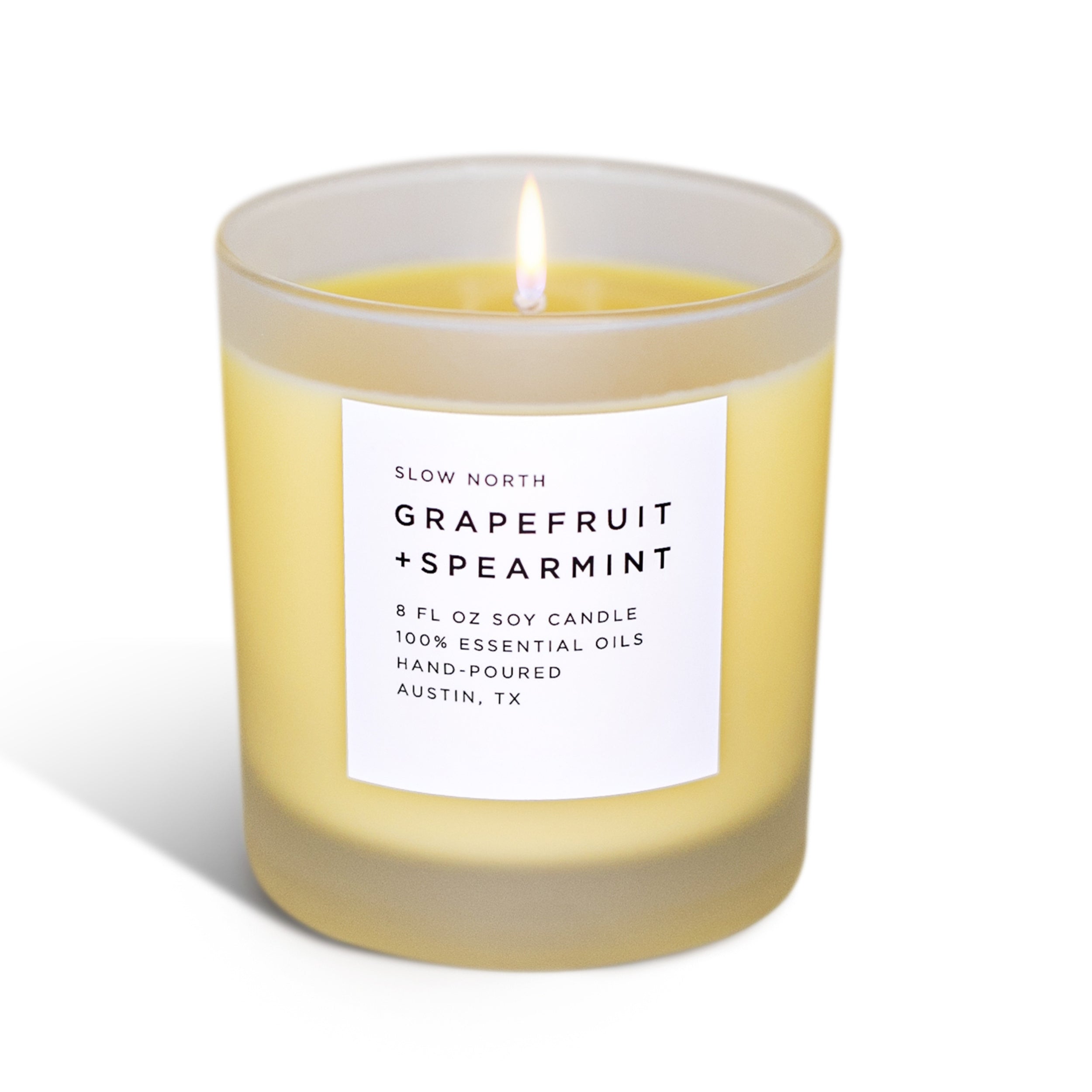 Grapefruit and spearmint nontoxic candle with a label on a white background